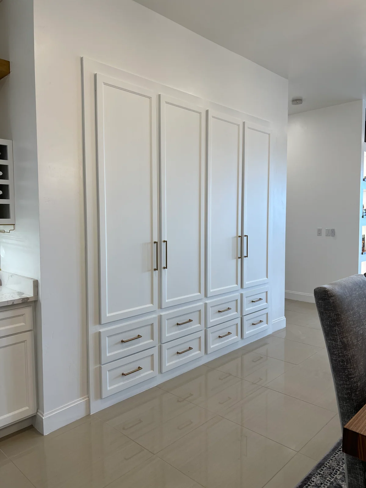 Full-height white pantry cabinets and drawers