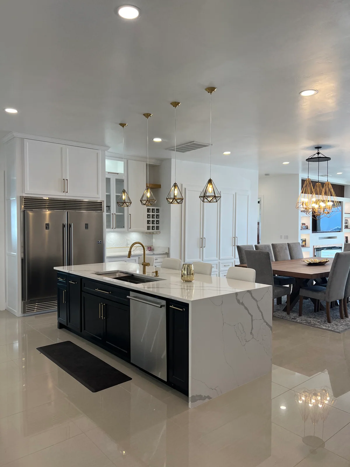 Black & Brass kitchen with white cabinetry, dark island, view 5