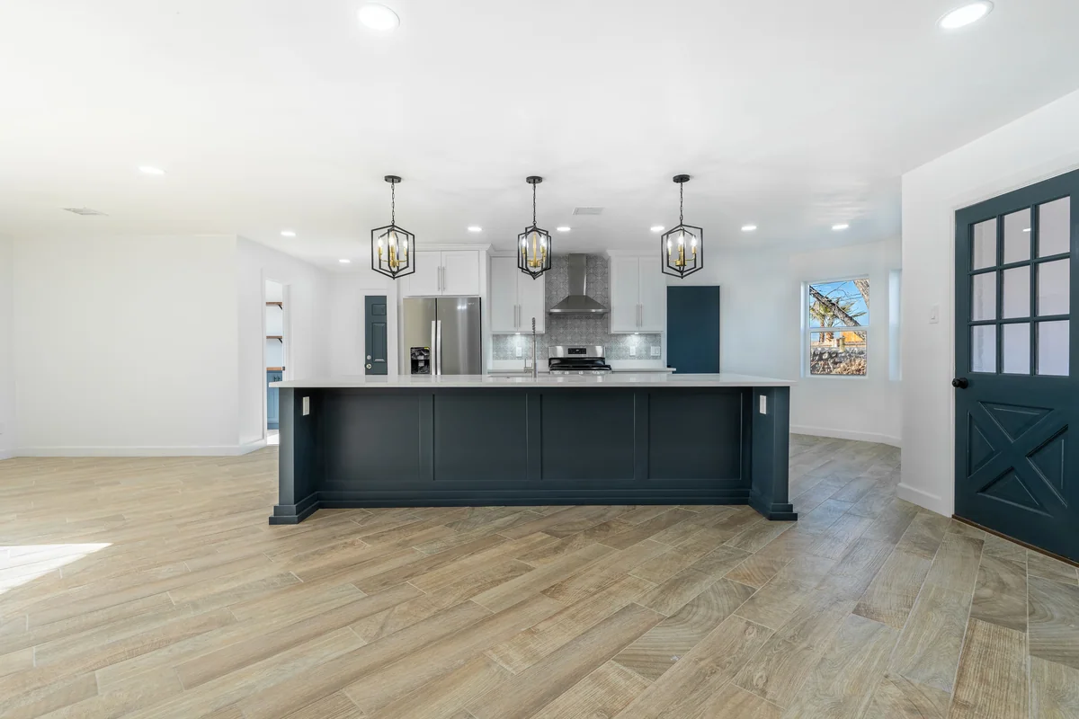 Blue Horizon kitchen with blue island, white cabinetry, view 1