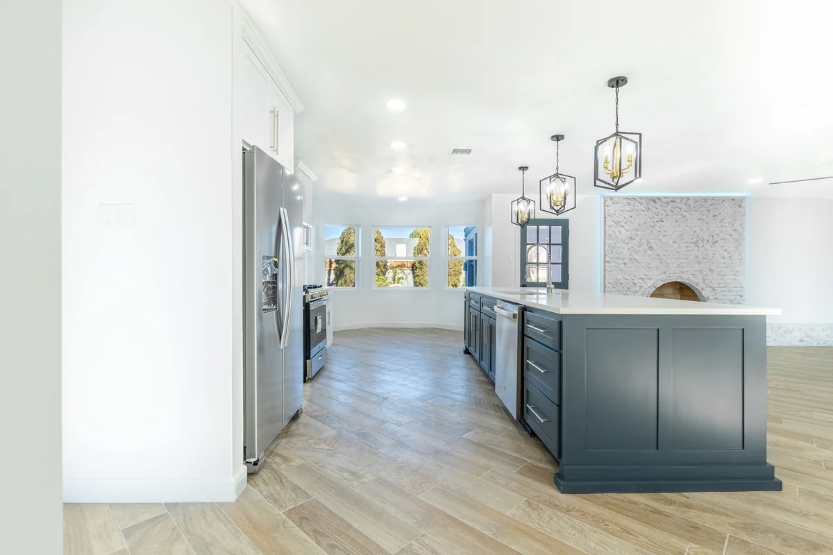 Blue Horizon kitchen with blue island, white cabinetry, view 3