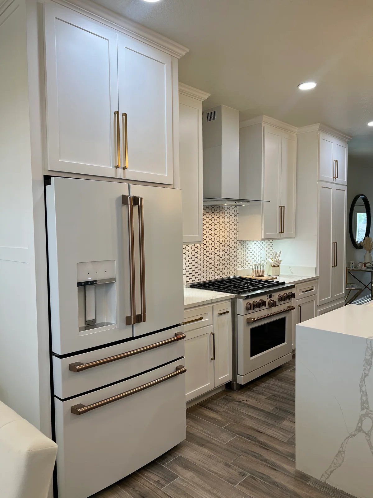 Clean Lines kitchen with light cabinetry, waterfall island, view 6