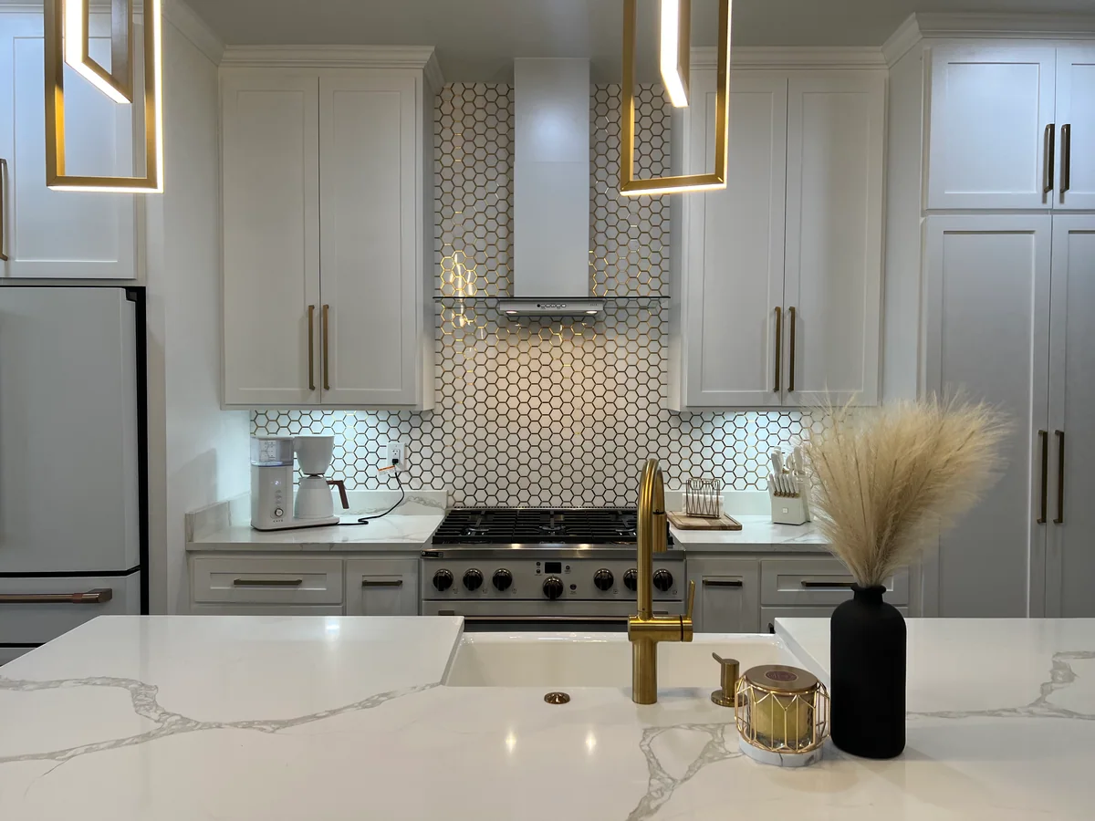 Clean Lines kitchen with light cabinetry, waterfall island, view 3