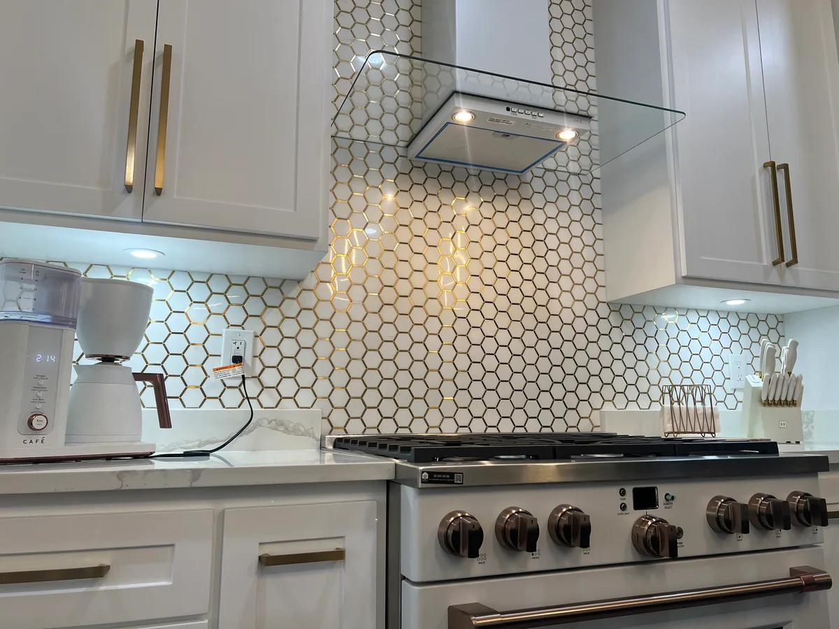 Clean Lines kitchen with light cabinetry, waterfall island, view 5