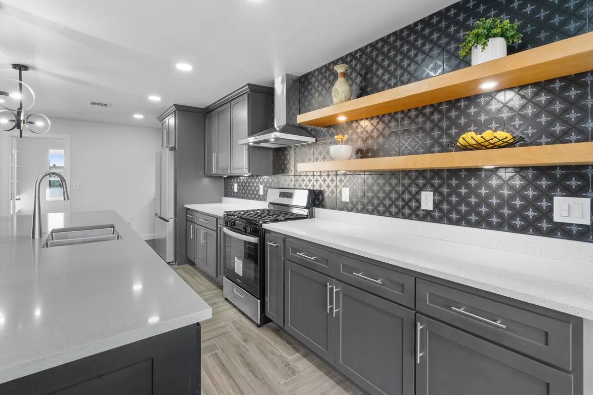 Modern Slate kitchen with gray cabinetry, floating wood shelves, view 3
