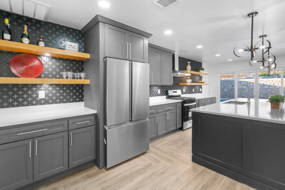 Modern Slate kitchen with gray cabinetry, floating wood shelves, view 2