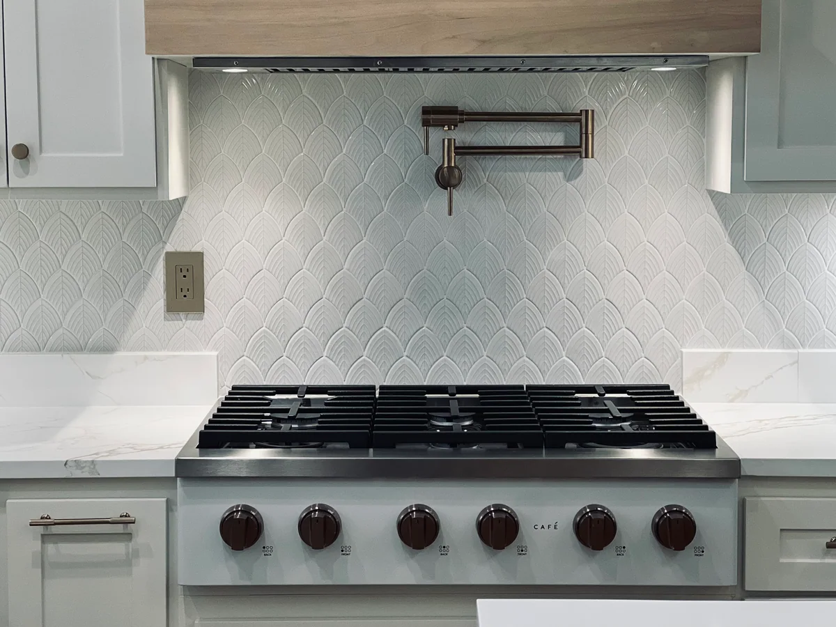 Natural Balance kitchen with white cabinetry, wood island, view 5