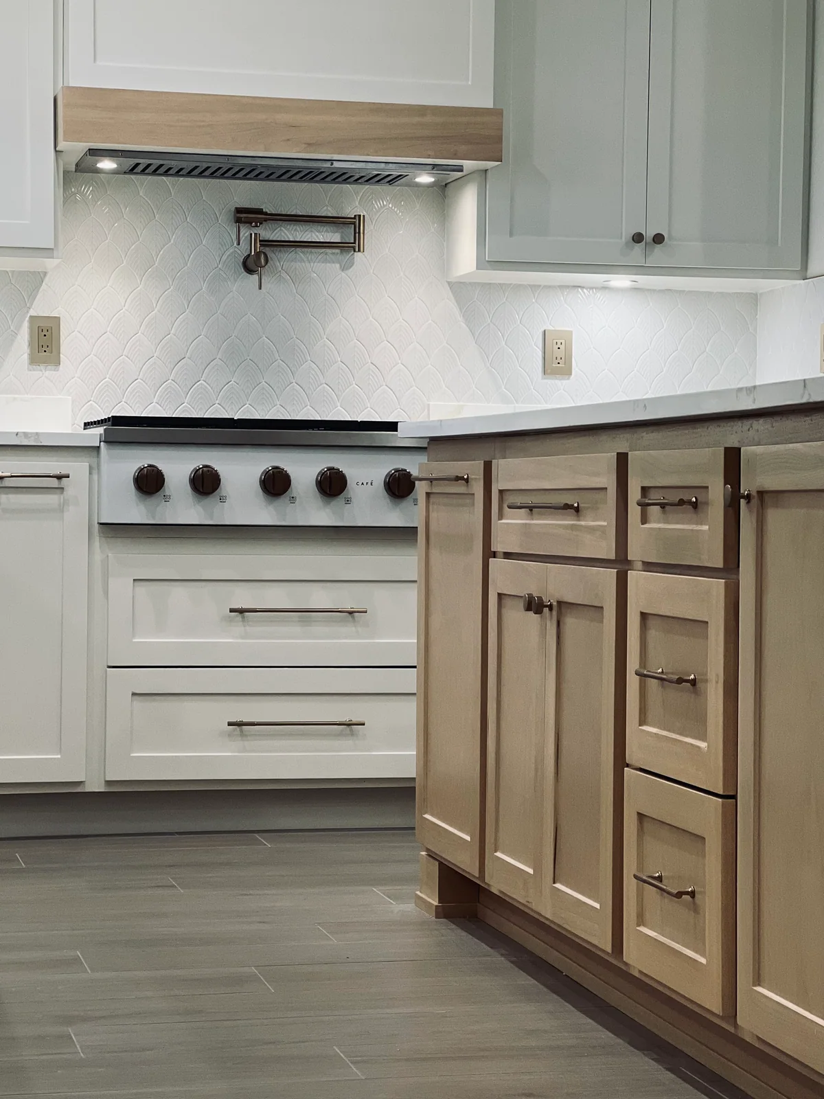Natural Balance kitchen with white cabinetry, wood island, view 7