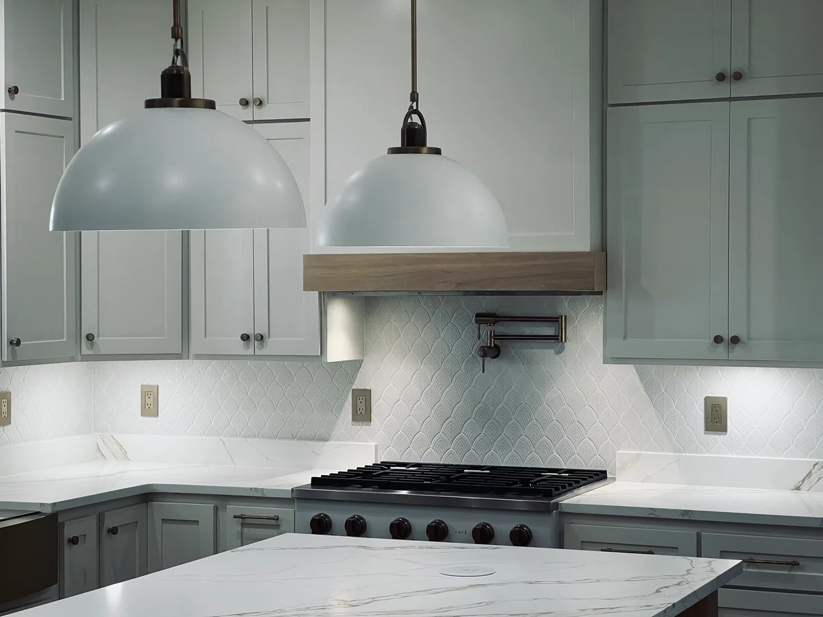 Natural Balance kitchen with white cabinetry, wood island, view 4