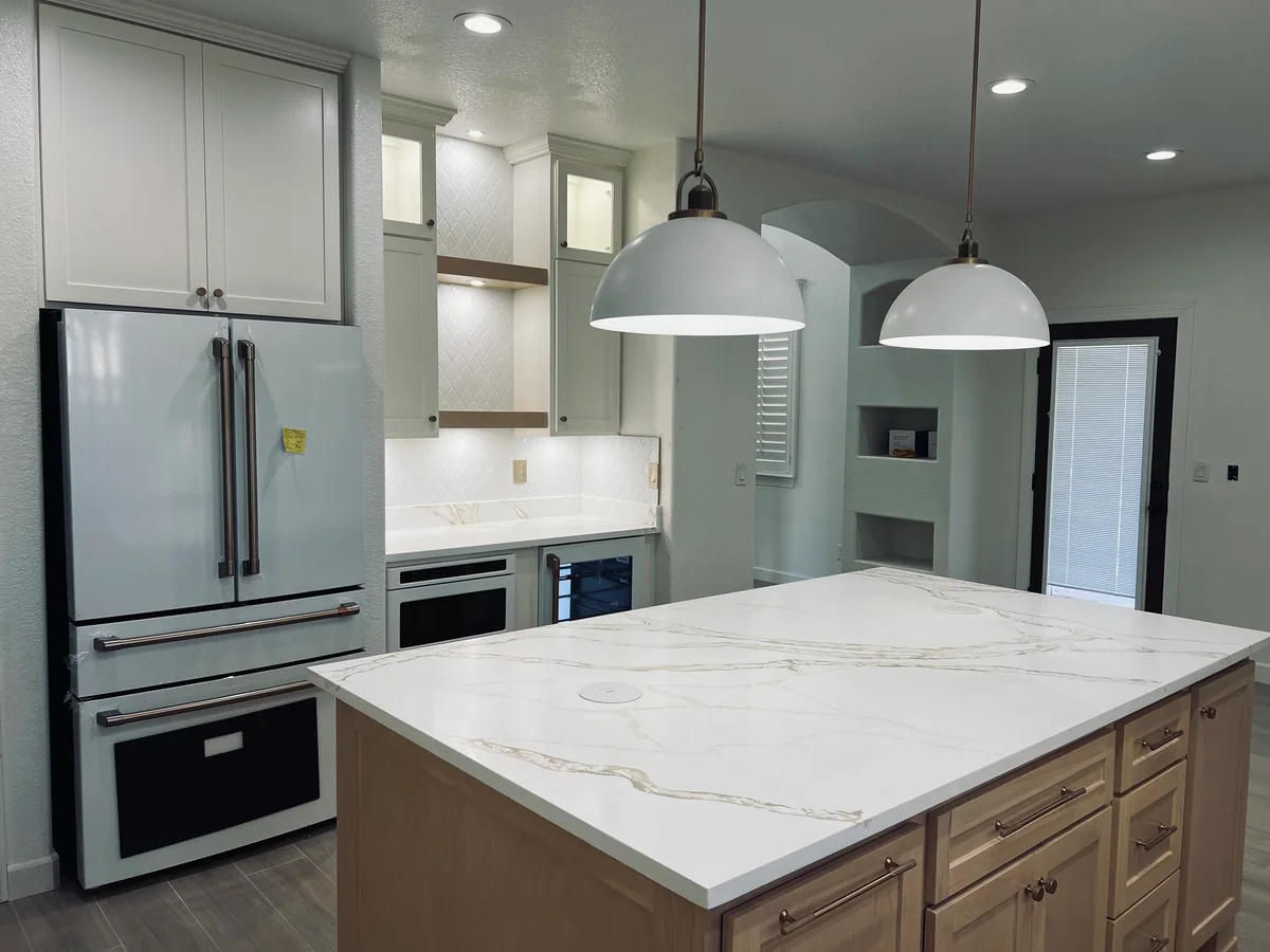 Natural Balance kitchen with white cabinetry, wood island, view 2