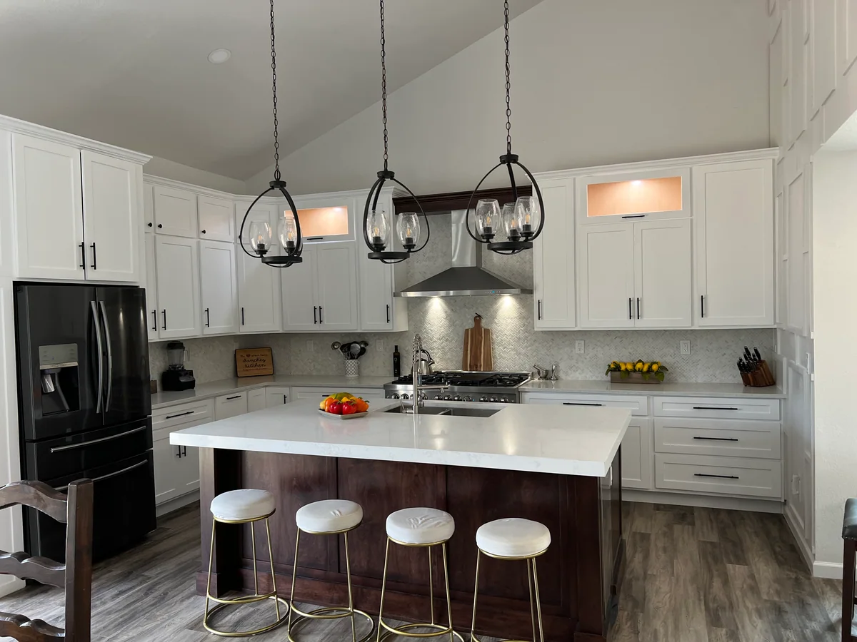 Open & Airy kitchen with white cabinetry, dark wood island, view 2