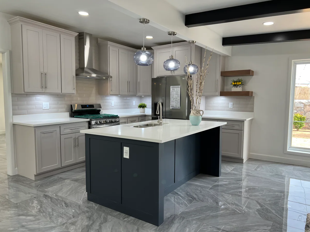 Simply Modern kitchen with two-tone cabinetry, dark island, view 1