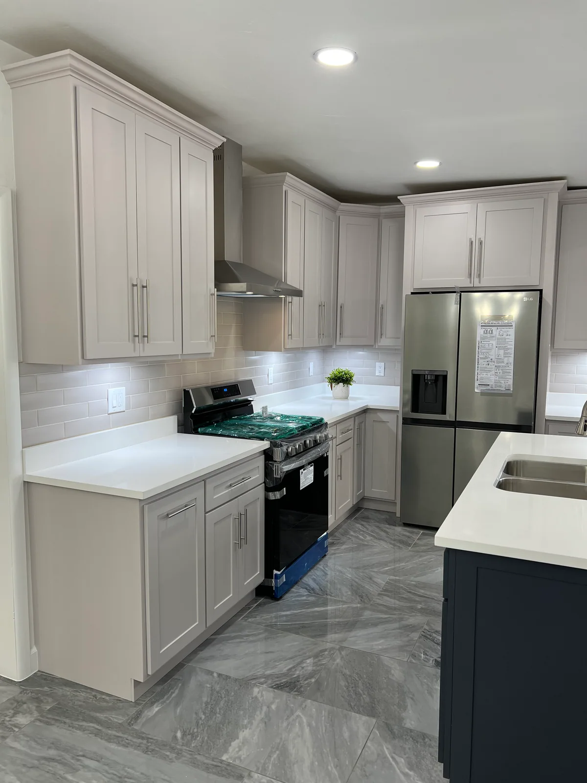 Simply Modern kitchen with two-tone cabinetry, dark island, view 2