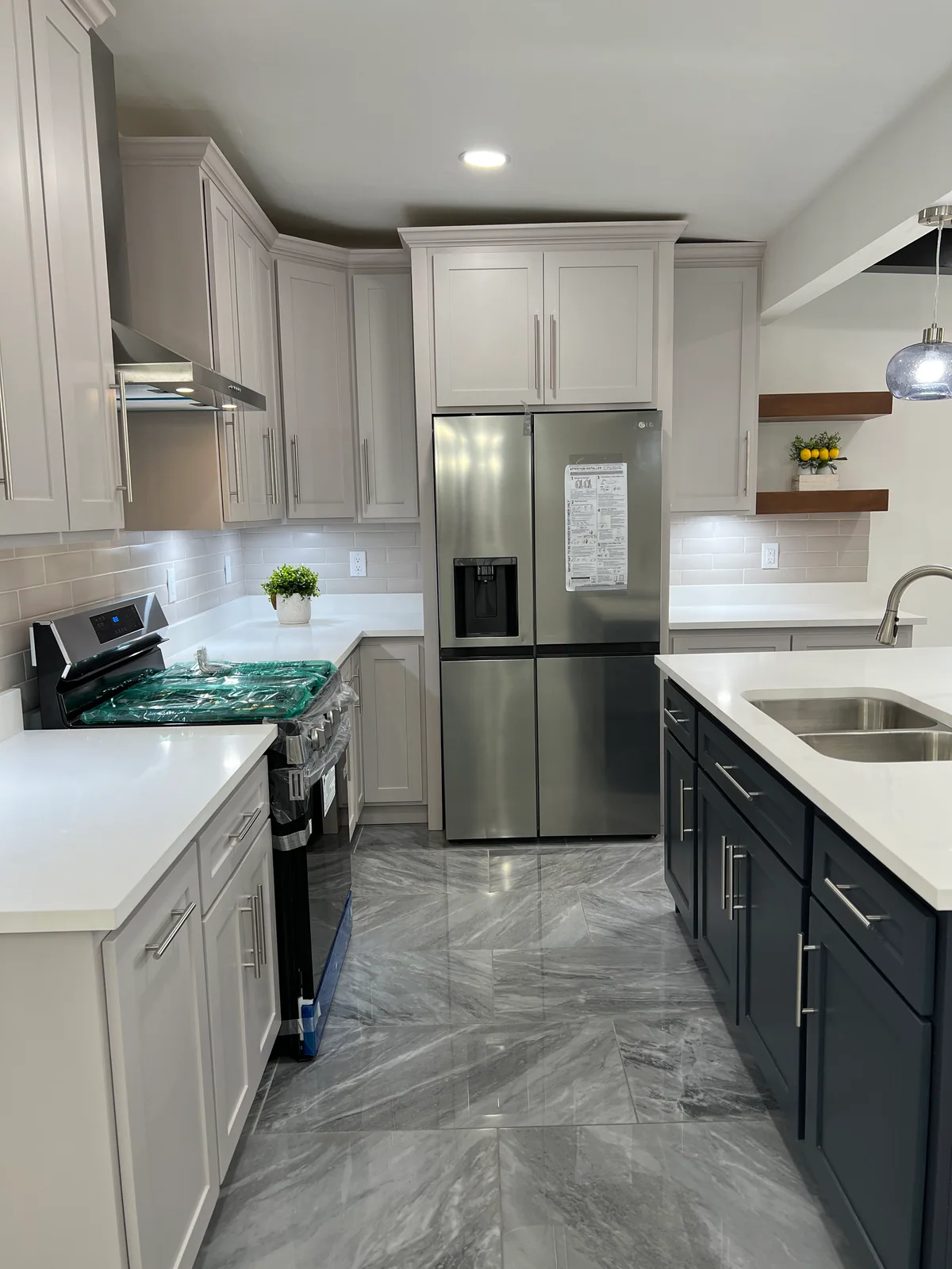Simply Modern kitchen with two-tone cabinetry, dark island, view 3