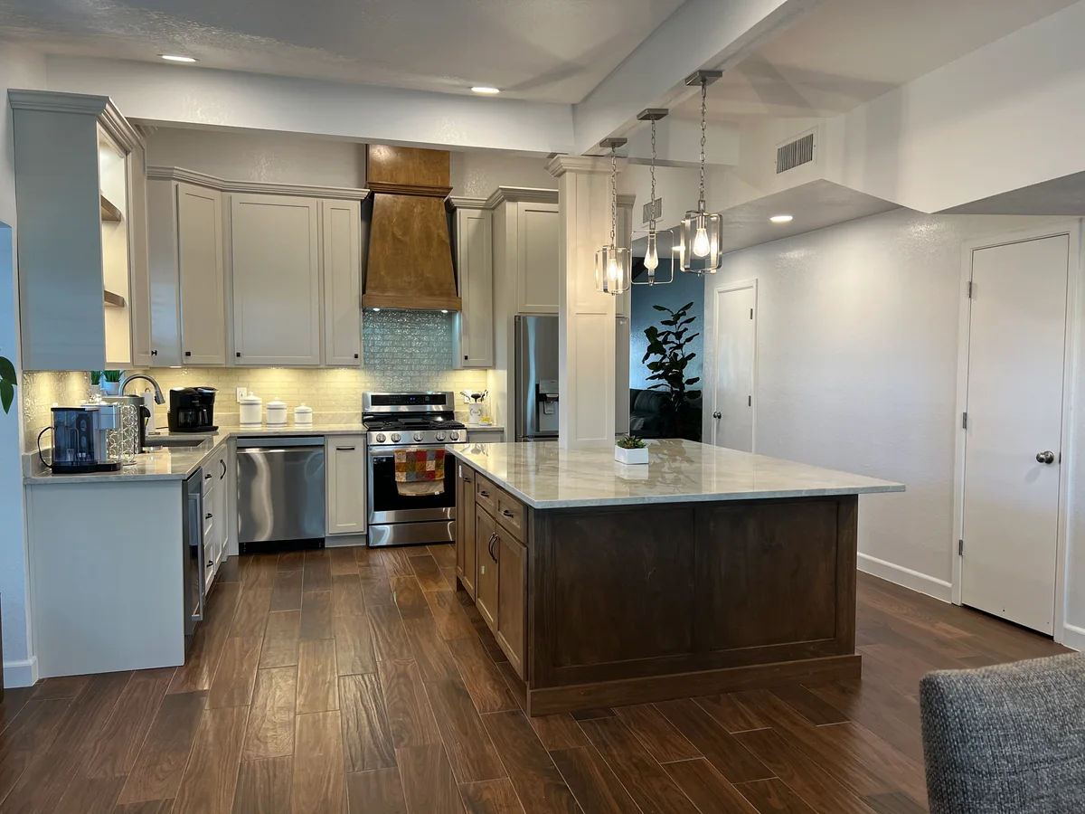 Warm Harmony kitchen with two-tone cabinetry, wood island, view 1