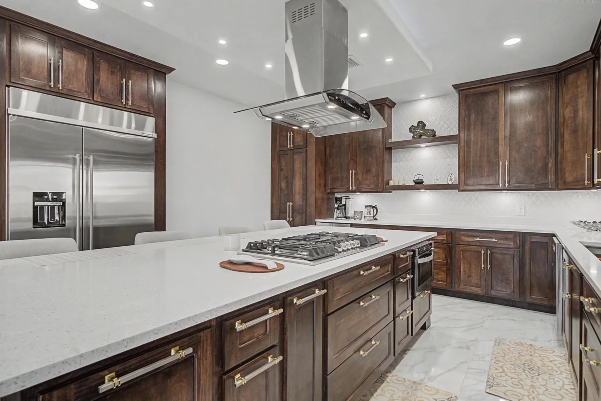 Warm Heritage kitchen with wood cabinetry, lighted glass cabinets, view 5