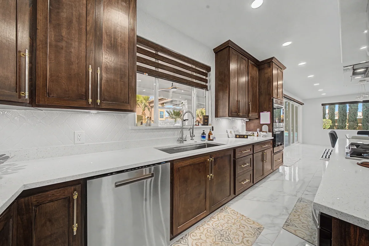 Warm Heritage kitchen with wood cabinetry, lighted glass cabinets, view 8